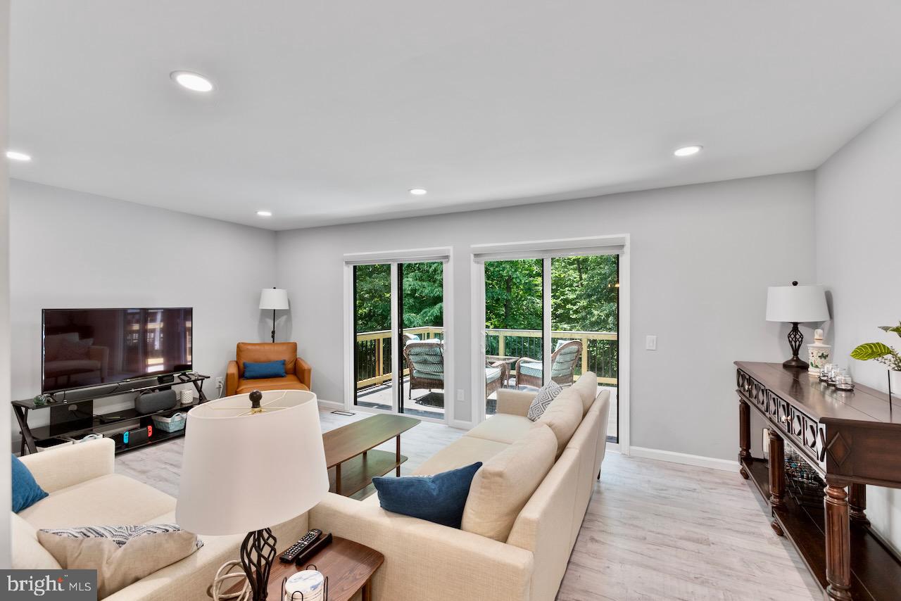 2224 Wheelwright Court Reston, VA 20191 - Photo 11 of 32 a living room with furniture and a flat screen tv