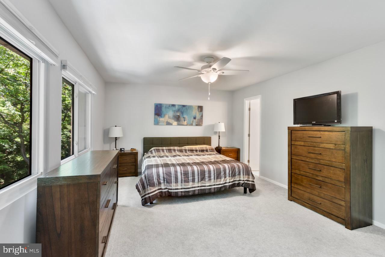 2224 Wheelwright Court Reston, VA 20191 - Photo 14 of 32 a bedroom with a bed and a flat screen tv