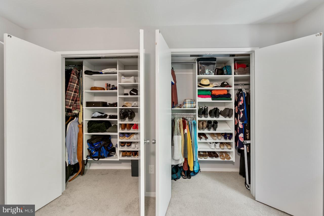 2224 Wheelwright Court Reston, VA 20191 - Photo 16 of 32 a view of walk in closet with clothes and shoes