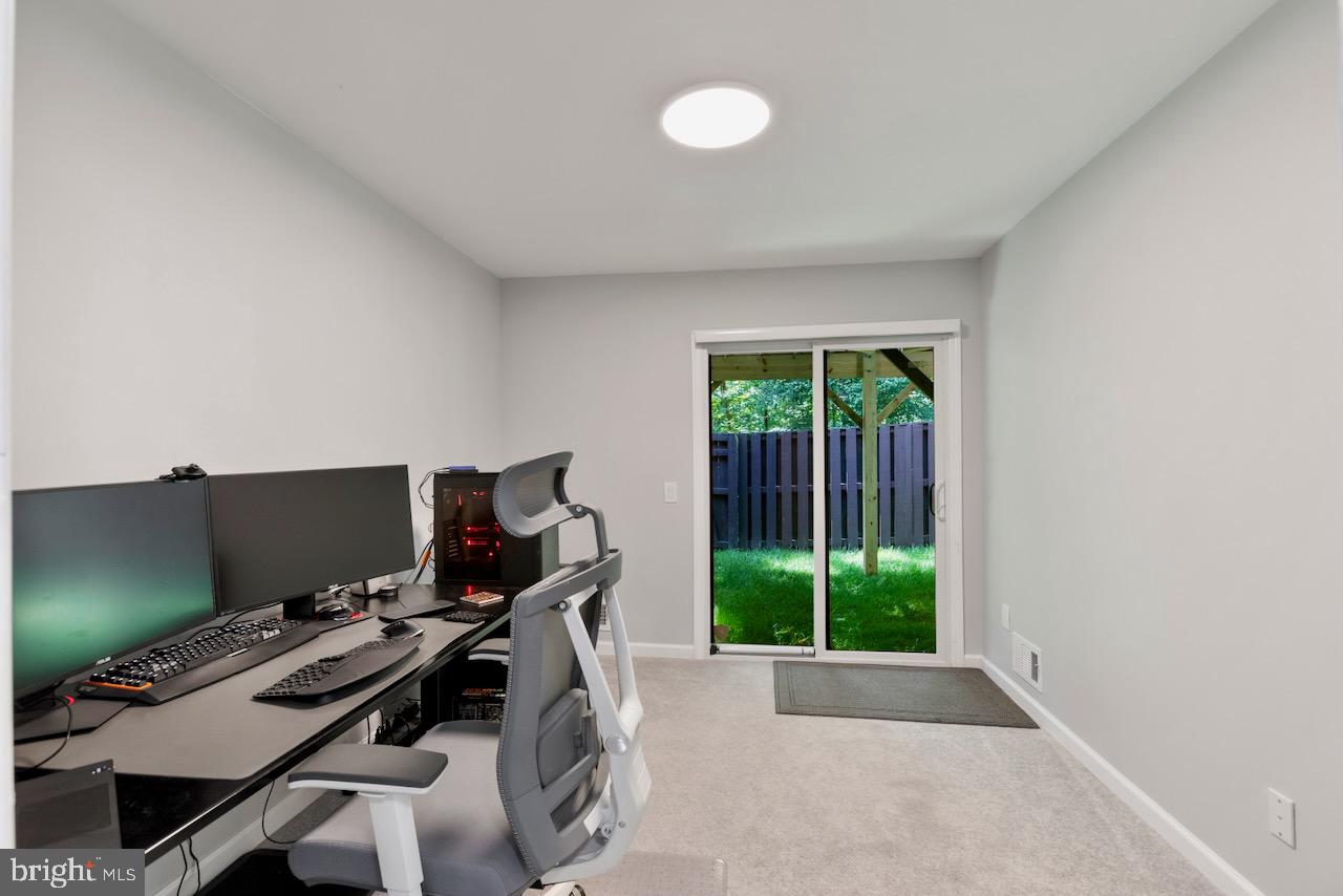 2224 Wheelwright Court Reston, VA 20191 - Photo 27 of 32 a view of a workspace with furniture and a window