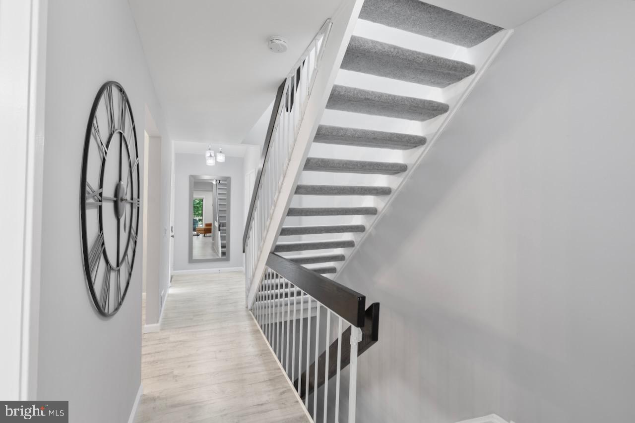 2224 Wheelwright Court Reston, VA 20191 - Photo 3 of 32 a view of staircase with white walls and a window
