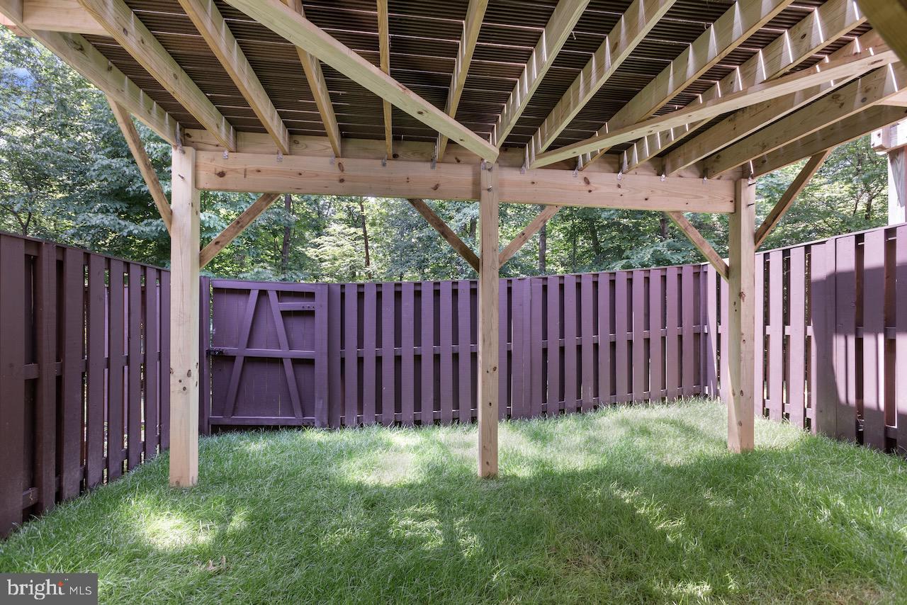 2224 Wheelwright Court Reston, VA 20191 - Photo 32 of 32 a view of a backyard with wooden fence