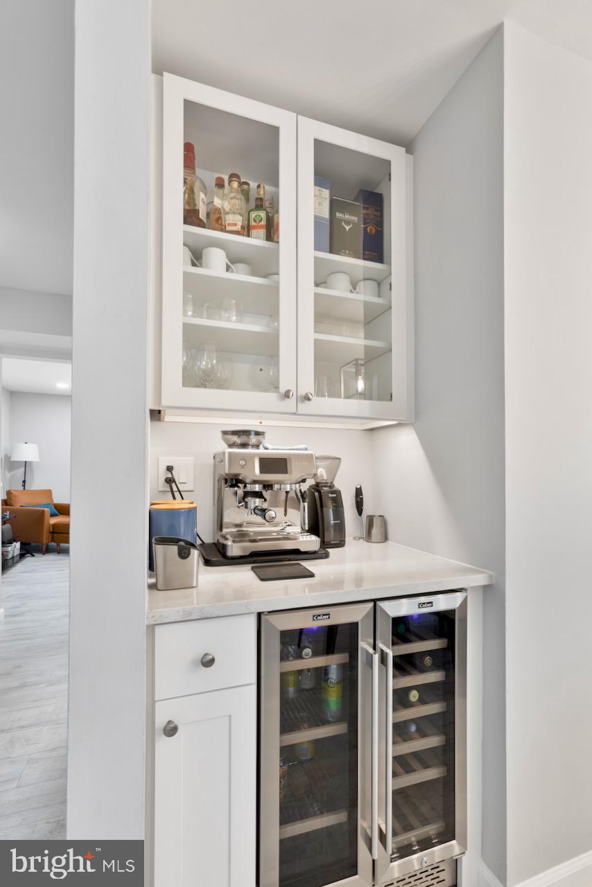 2224 Wheelwright Court Reston, VA 20191 - Photo 6 of 32 a kitchen with stainless steel appliances a stove and white cabinets