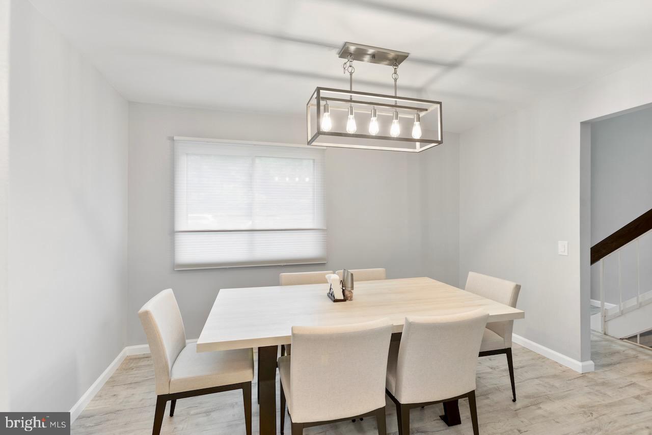 2224 Wheelwright Court Reston, VA 20191 - Photo 7 of 32 a view of a dining room with a table and chairs