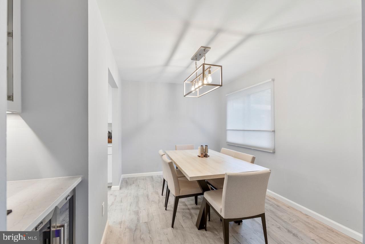 2224 Wheelwright Court Reston, VA 20191 - Photo 8 of 32 a view of a dining room with furniture and wooden floor