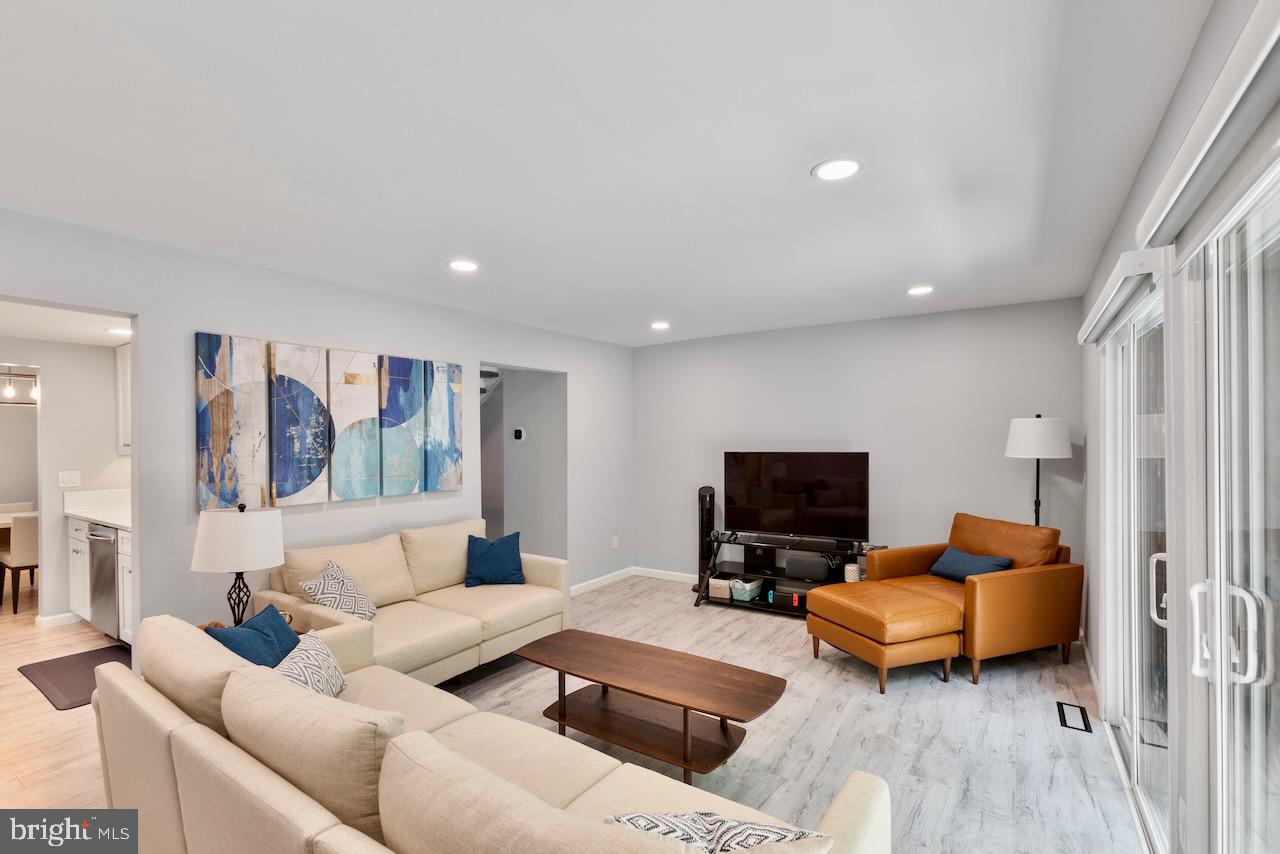 2224 Wheelwright Court Reston, VA 20191 - Photo 9 of 32 a living room with furniture and a flat screen tv