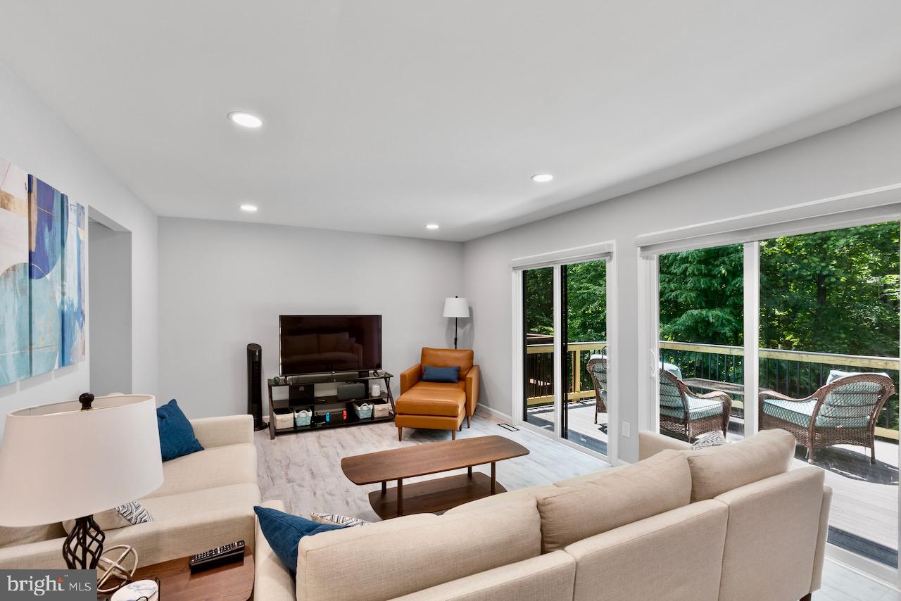2224 Wheelwright Court Reston, VA 20191 - Photo 10 of 32 a living room with furniture and a flat screen tv