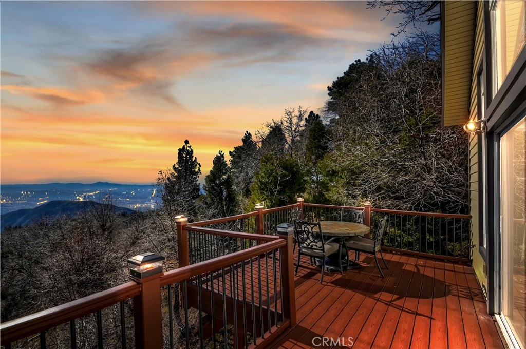a view of balcony with furniture and wooden floor