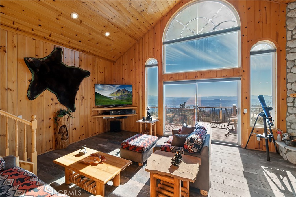 2477 Spring Oak Drive Running Springs, CA 92382 - Photo 21 of 51 a living room with furniture and a flat screen tv