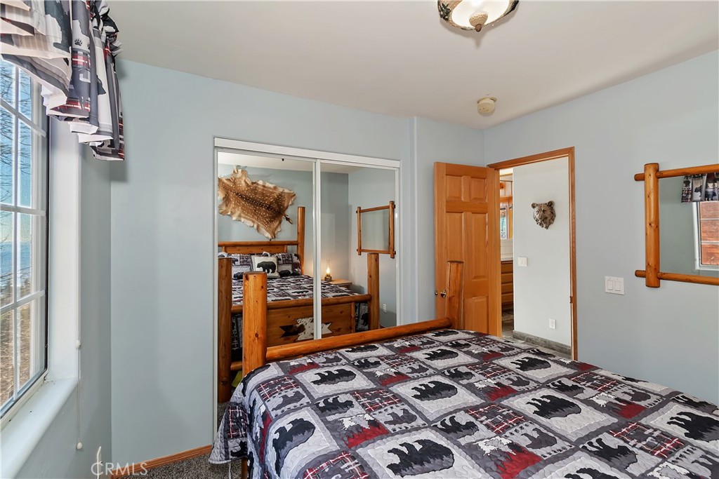 2477 Spring Oak Drive Running Springs, CA 92382 - Photo 25 of 51 a bedroom with a bed and a dresser