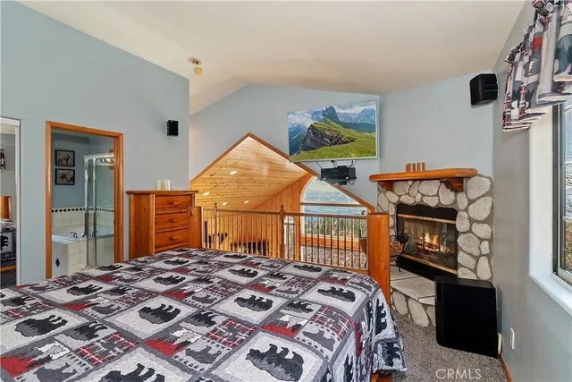 a bedroom with a bed a dresser and chair