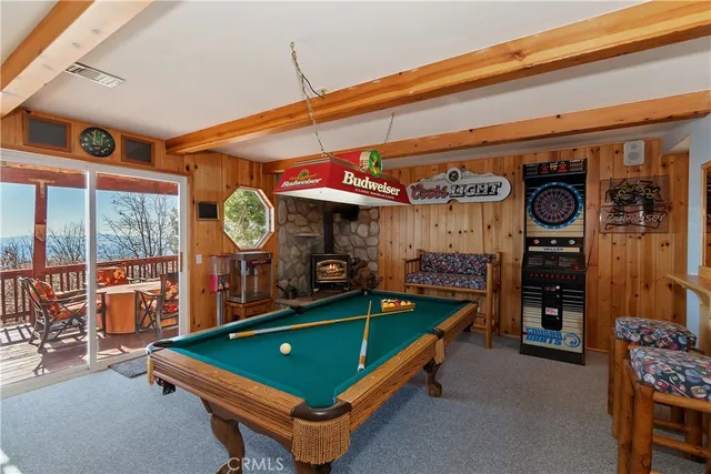 a living room with a table and chairs