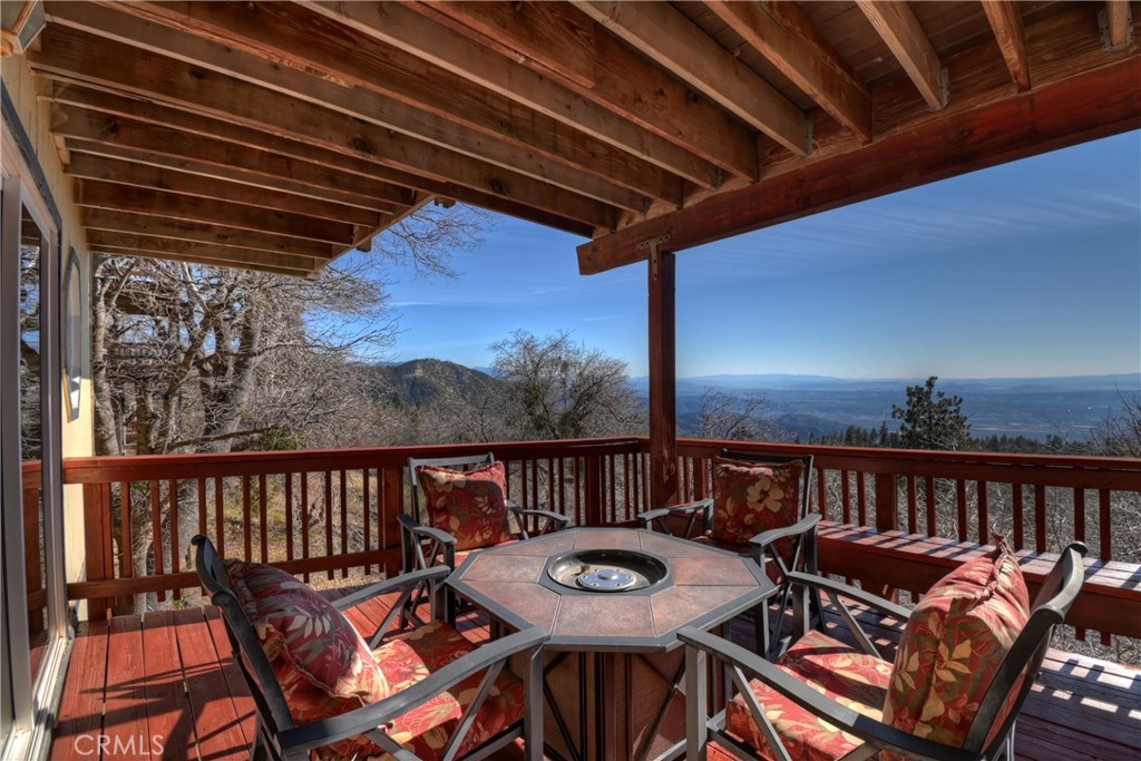 2477 Spring Oak Drive Running Springs, CA 92382 - Photo 37 of 51 a view of a balcony with furniture and wooden floor