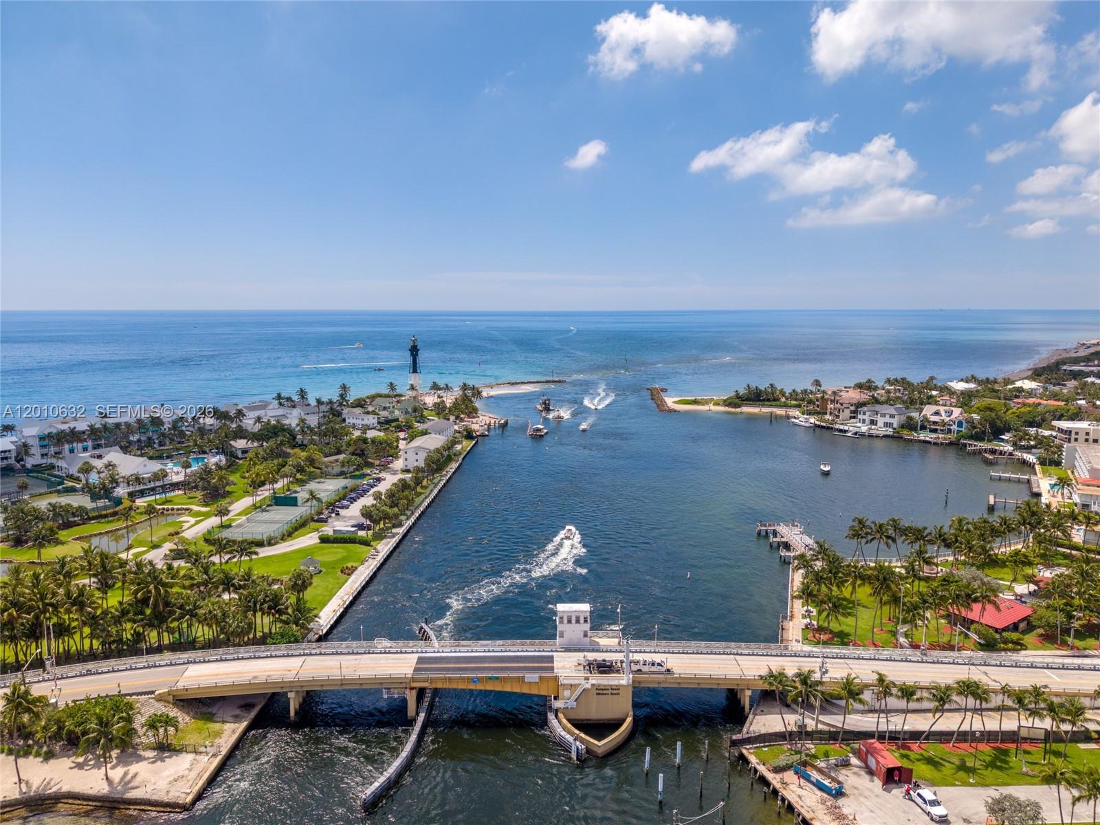2639 North Riverside Drive, Unit 501 Pompano Beach, FL 33062 - Photo 31 of 39 an aerial view of a city with lots of residential buildings ocean and mountain view in back