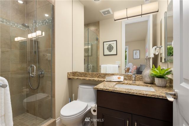 a view of a storage & utility room with sink dryer and washer