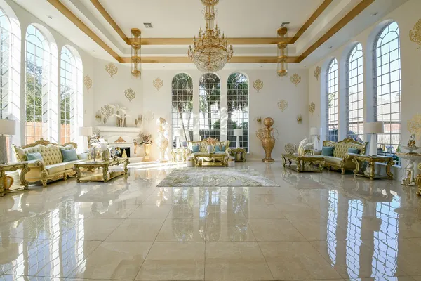 a living room with furniture and floor to ceiling windows