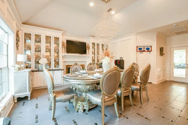 a dining room with furniture a window and a kitchen view
