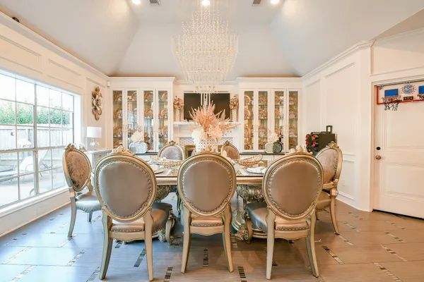 a dining room with furniture mountain view and wooden floor