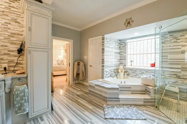 a dining room with wooden floor and a table