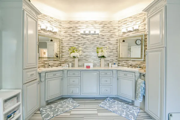 a spacious bathroom with a granite countertop sink mirror and a