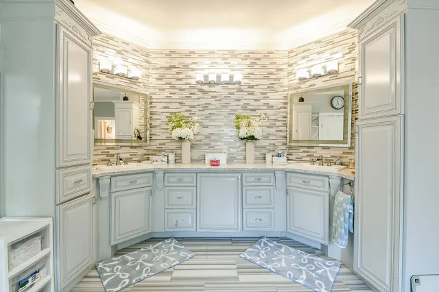 a spacious bathroom with a granite countertop sink mirror and a