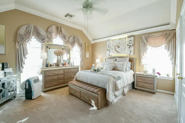 a bed room with a bed and a large window