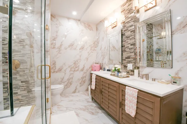 a bathroom with a double vanity sink and a shower