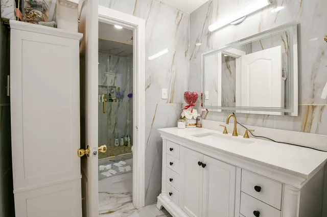 a bathroom with a sink and a mirror