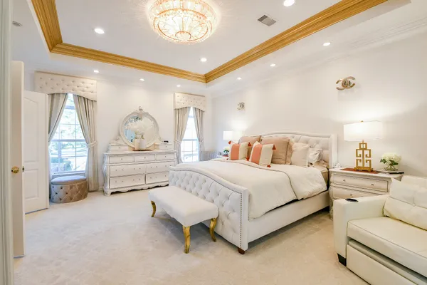 a spacious bedroom with a bed and window