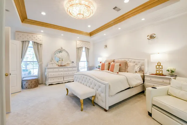 a spacious bedroom with a bed and window