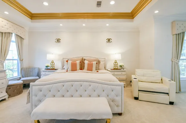 a bedroom with a bed and a night stand