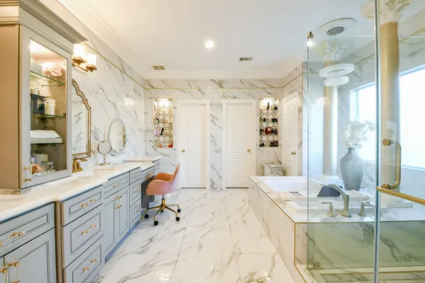 a spacious bathroom with a double vanity sink mirror and double