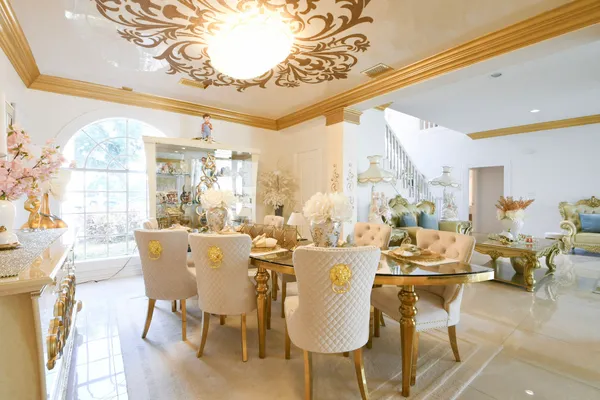 a view of a dining room with furniture window and outside view