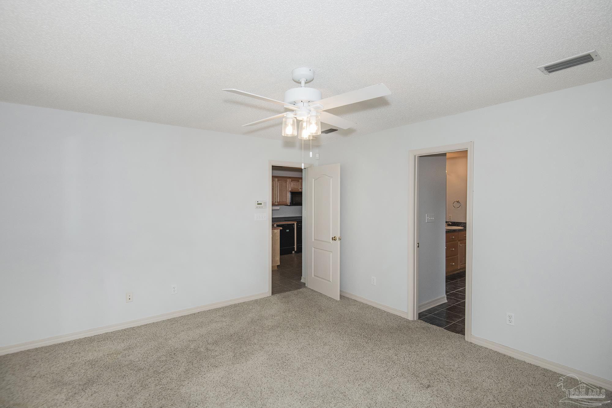 4565 South Spencer Field Road Pace, FL 32571 - Photo 20 of 49 a view of an empty room with a ceiling fan