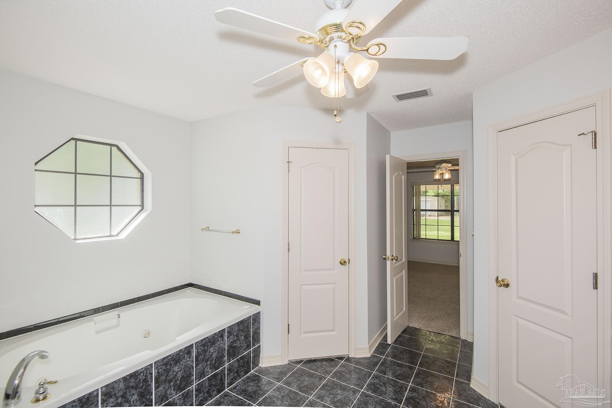 4565 South Spencer Field Road Pace, FL 32571 - Photo 25 of 49 wooden floor in an empty room with a window