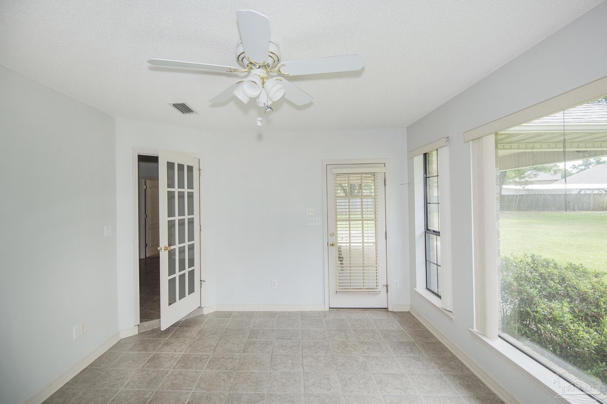 4565 South Spencer Field Road Pace, FL 32571 - Photo 28 of 49 a view of an empty room with a window