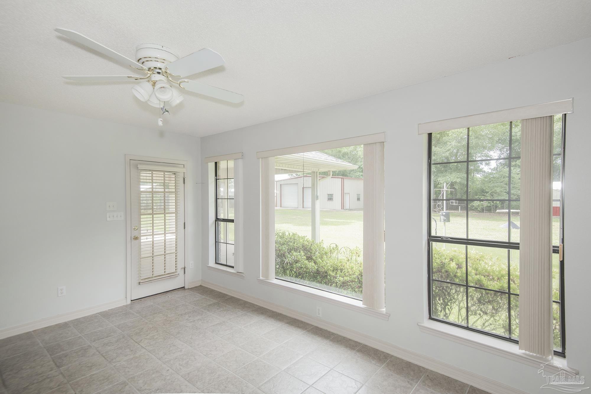4565 South Spencer Field Road Pace, FL 32571 - Photo 29 of 49 a view of an empty room with a window