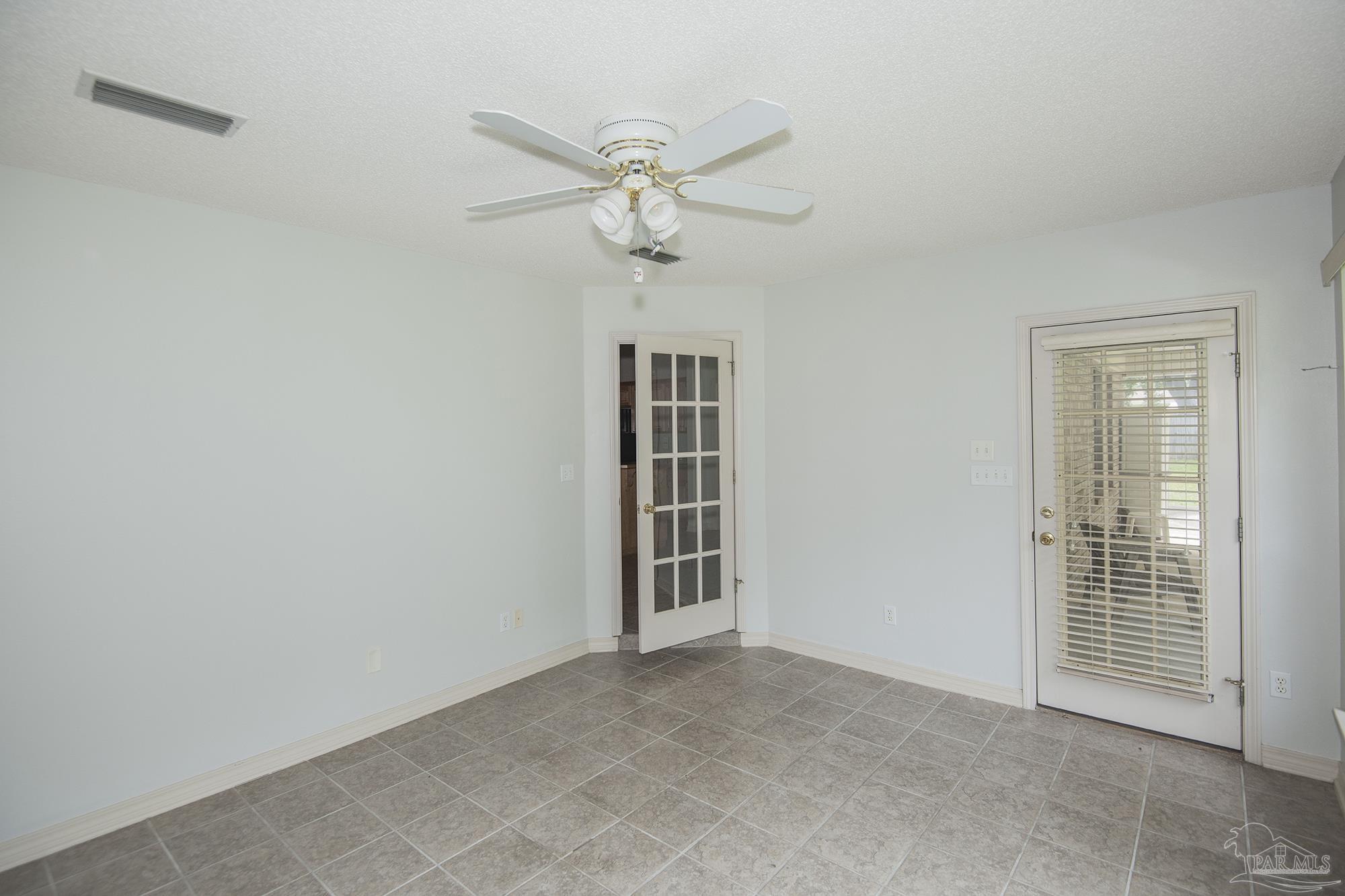 4565 South Spencer Field Road Pace, FL 32571 - Photo 31 of 49 a view of an empty room with a window