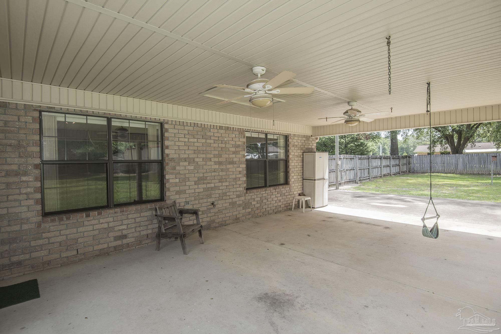 4565 South Spencer Field Road Pace, FL 32571 - Photo 33 of 49 a view of an empty room with a fireplace