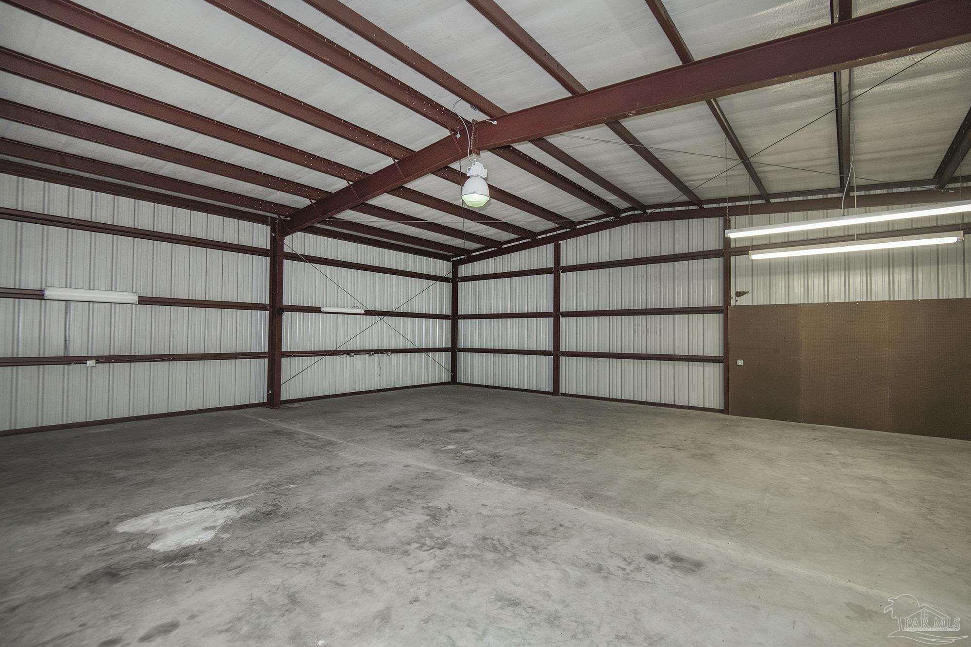 4565 South Spencer Field Road Pace, FL 32571 - Photo 39 of 49 a view of a room with racks