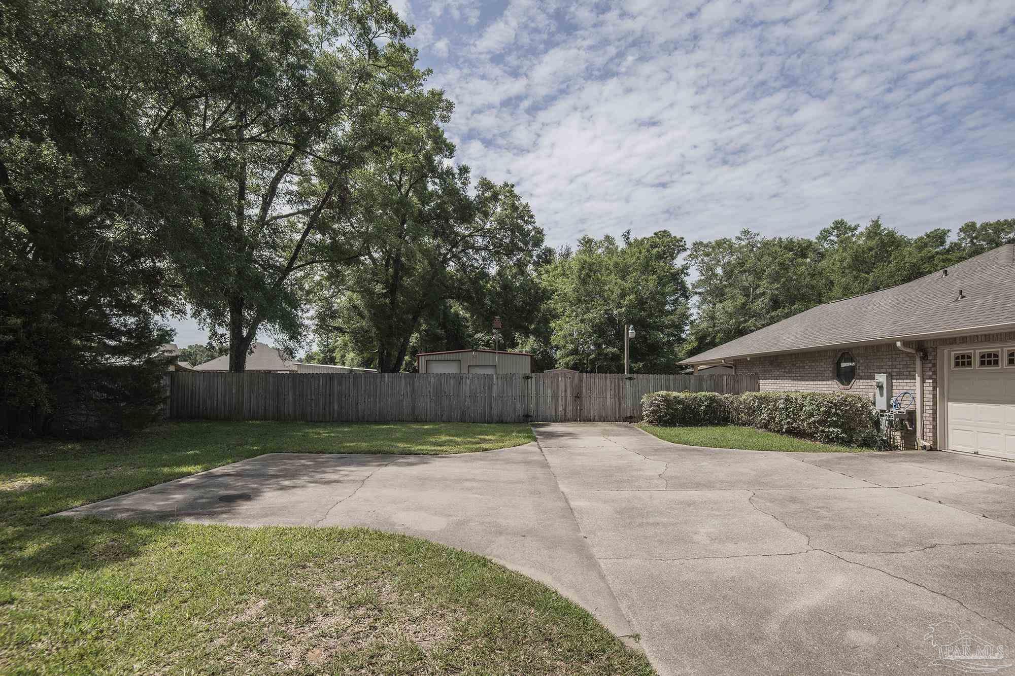 4565 South Spencer Field Road Pace, FL 32571 - Photo 4 of 49 a view of a backyard