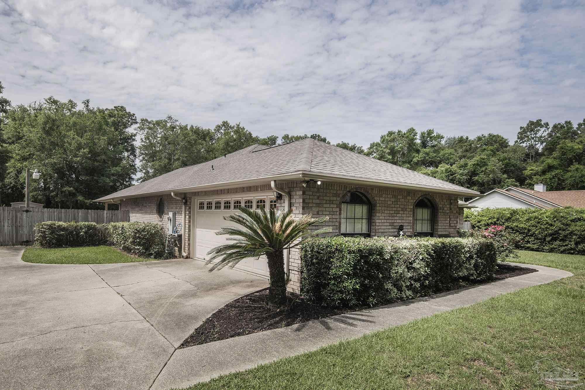 4565 South Spencer Field Road Pace, FL 32571 - Photo 44 of 49 a front view of a house with a yard