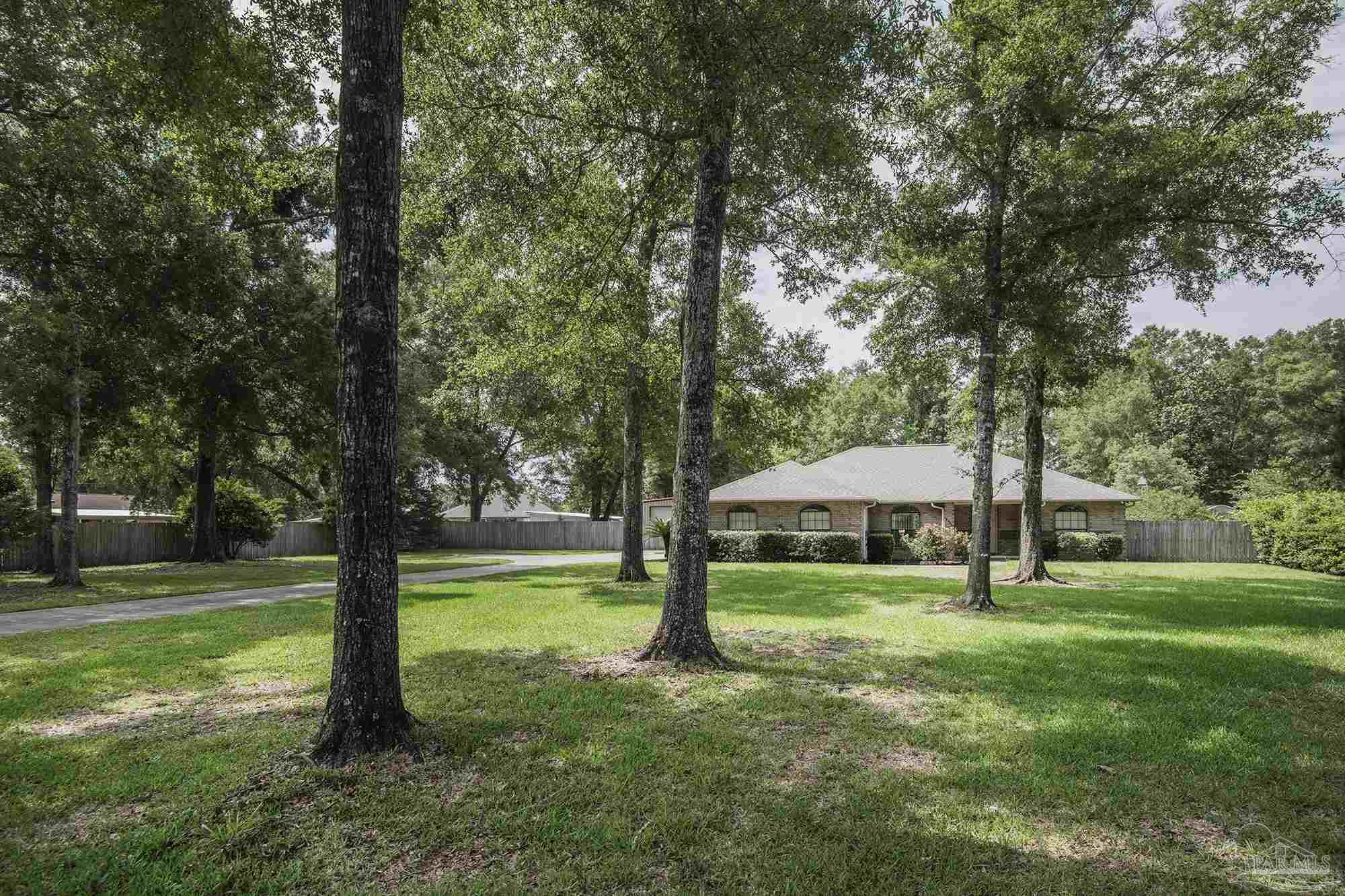 4565 South Spencer Field Road Pace, FL 32571 - Photo 49 of 49 a view of a park with large trees