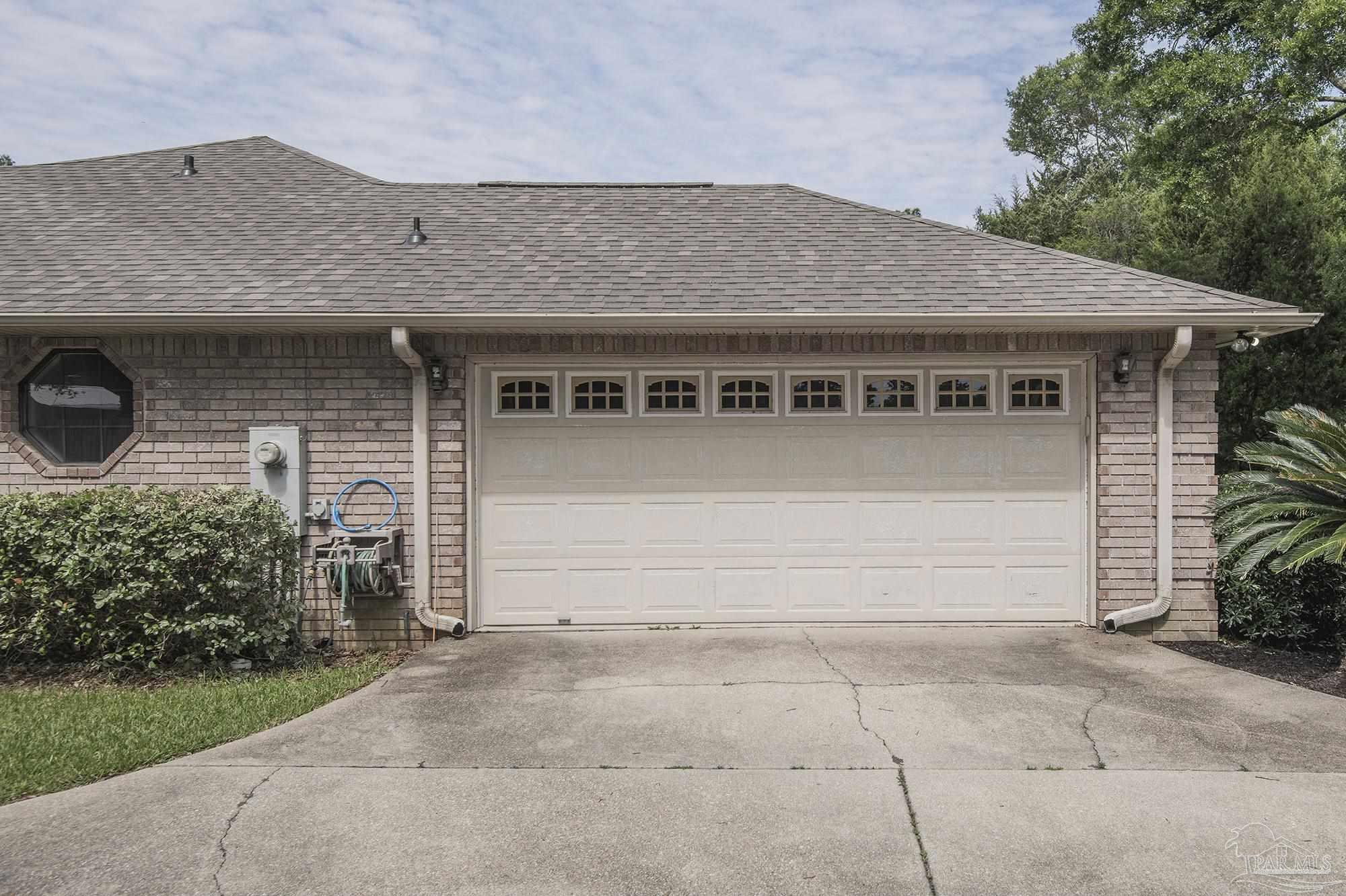 4565 South Spencer Field Road Pace, FL 32571 - Photo 5 of 49 a front view of a house with garden