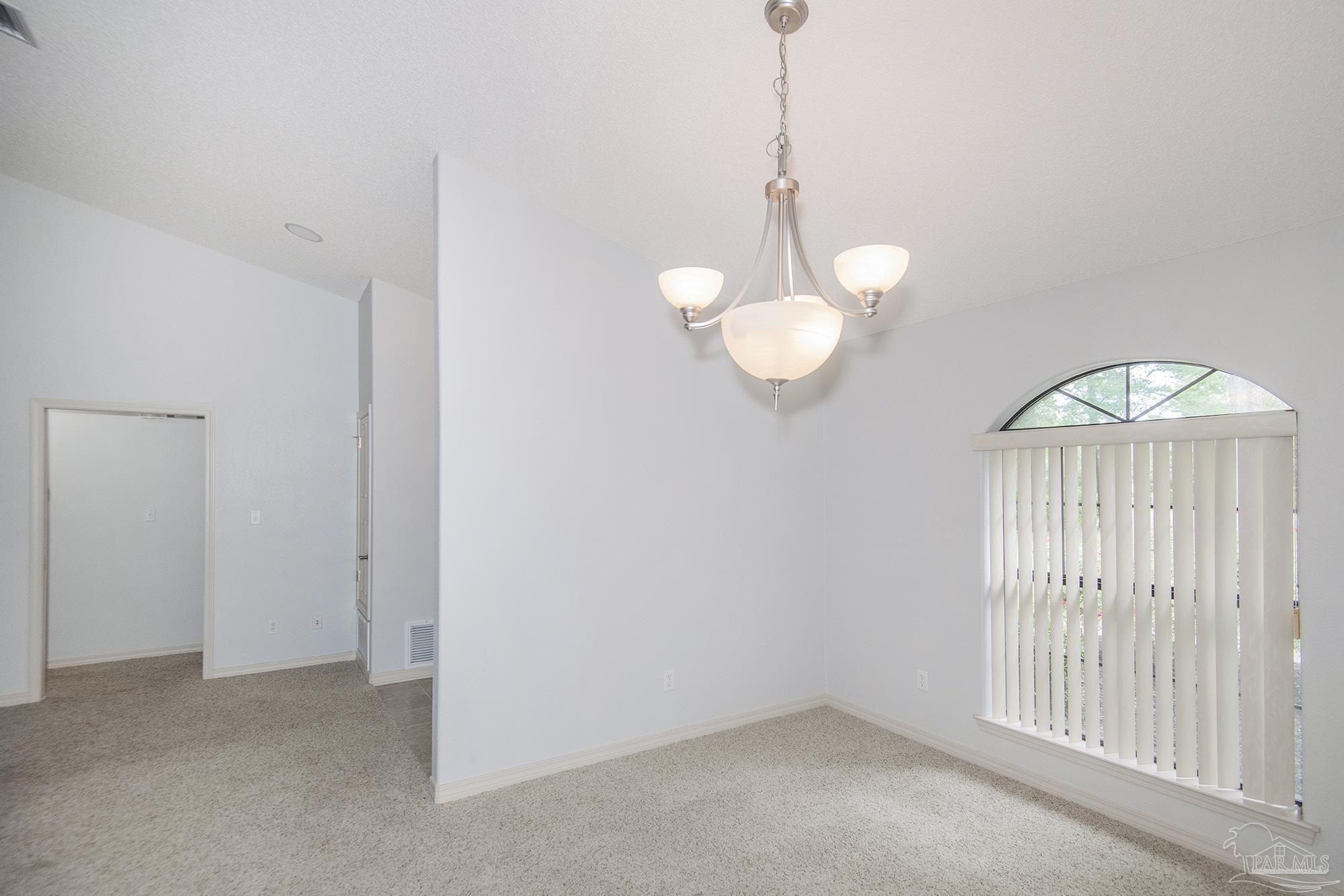 4565 South Spencer Field Road Pace, FL 32571 - Photo 7 of 49 an empty room with windows