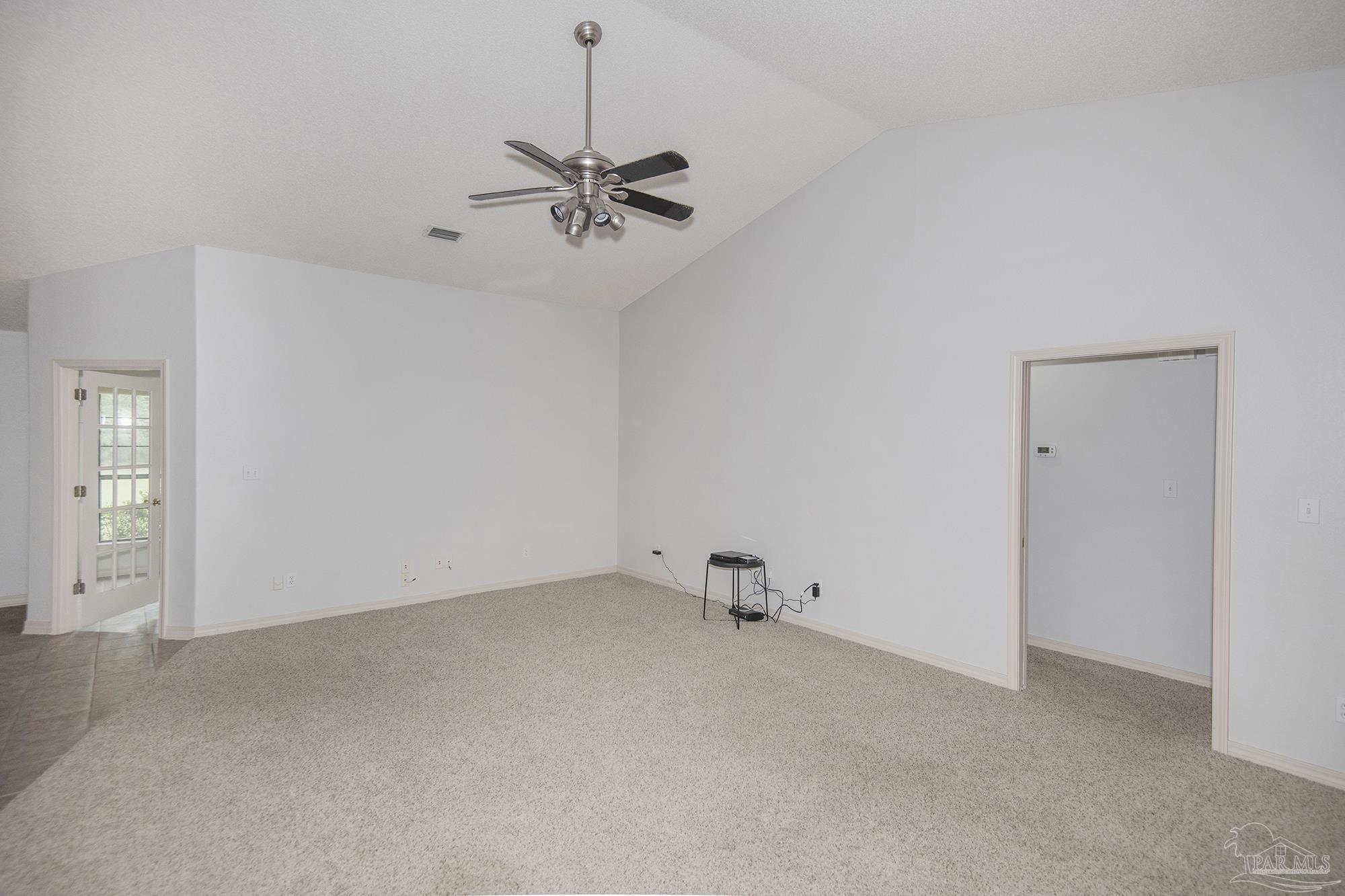 4565 South Spencer Field Road Pace, FL 32571 - Photo 9 of 49 an empty room with a view of a room