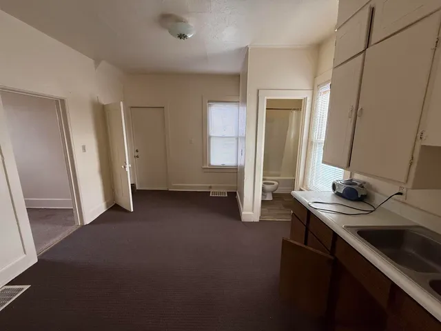 a view of a bathroom with a sink and a mirror