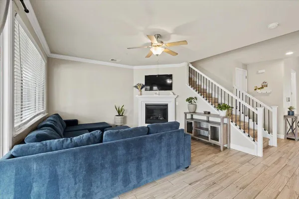 a kitchen with kitchen island a counter top space a sink stainless steel appliances and cabinets