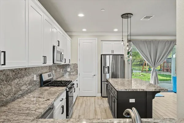 a view of an entryway with wooden floor and stairs