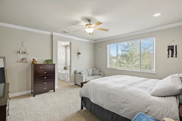 a living room with furniture and a dresser